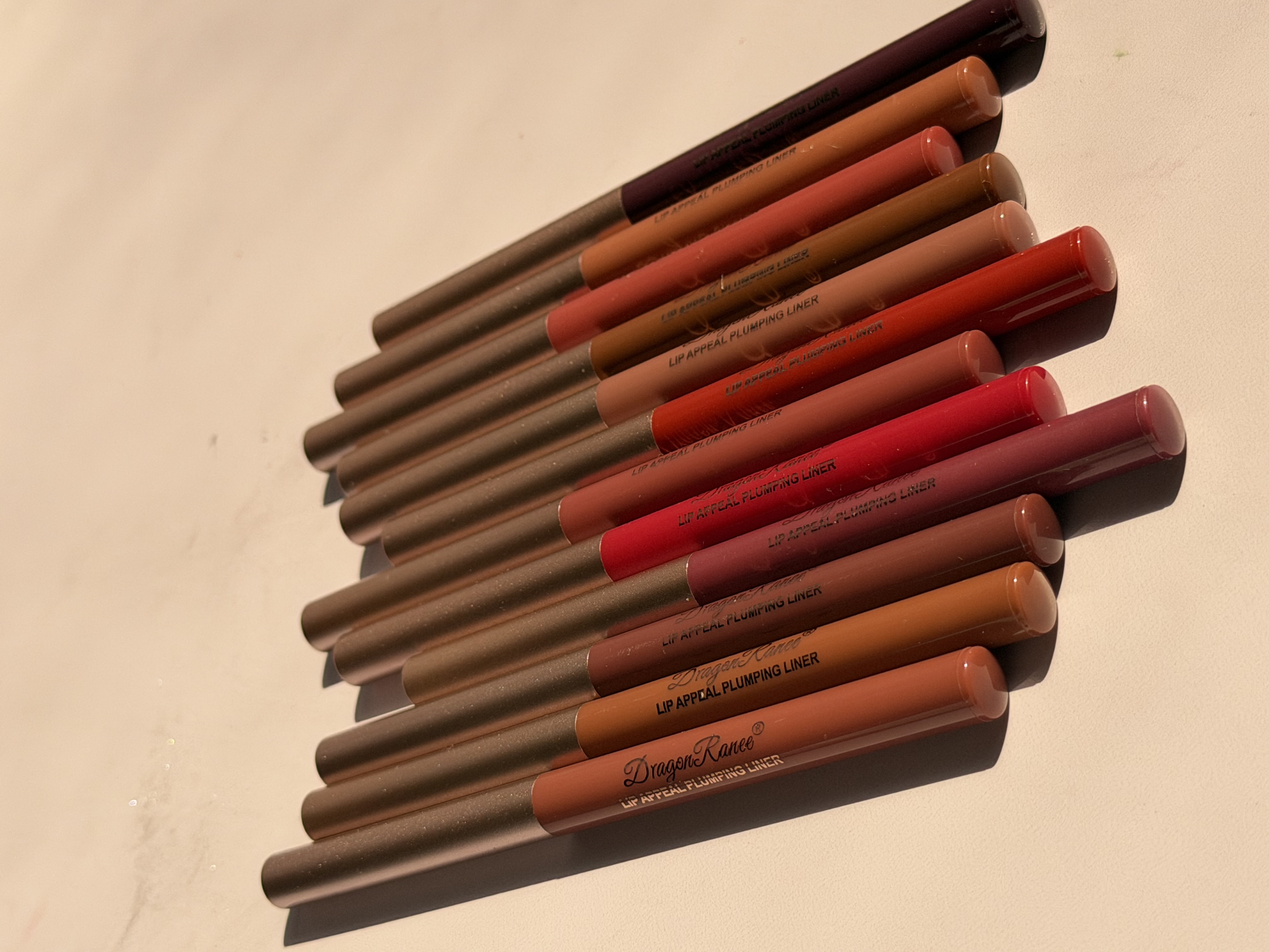 پک ۱۲ عددی خط لب دراگون رانی مدل Luxe Lip Liner Collection | رنگ‌بندی نود و قرمز